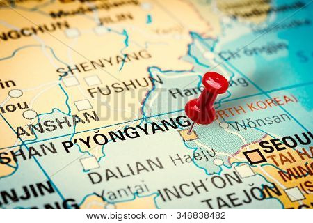 Prague, Czech Republic - January 12, 2019: Red Thumbtack In A Map. Pushpin Pointing At Pyongyang Cit