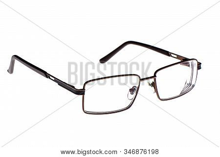 Glasses In A Metal Frame Isolated On A White Background. Glasses With Plastic Earhooks. Copy Space.