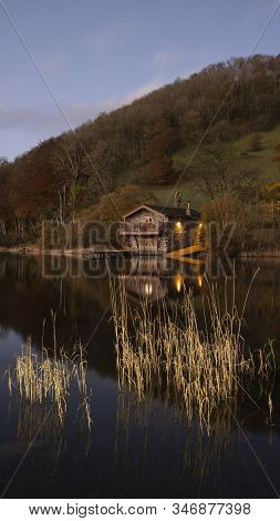 Stunning Sunrise Autumn Fall Landscape Image Of Ullswater In Lake District With Golden Sunlight
