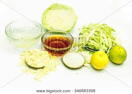 Close Up Of Cabbage Face Mask Isolated On White. Horizontal Shot Of A Bowl With Some Cabbage Paste W