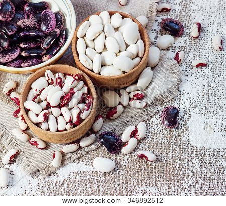 Colored Beans In Wooden Cups On A Light Background