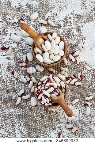 White-pink Beans In A Wooden Cup On A Light Background