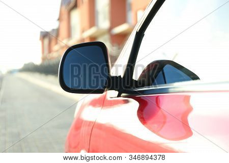Side Rear View Mirror Of Modern Car Outdoors