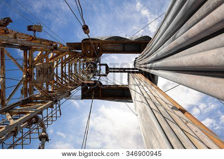 Oil And Gas Drilling Rig. Oil Platform Isolated On White Background. Drilling Rig In Oil Field For D