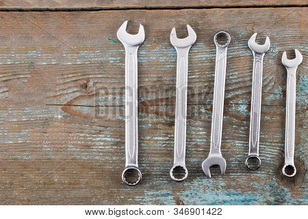 Spanners Or Adjustable Wrenches On Wooden Background, Basic Hand Tools.with Copy Space.