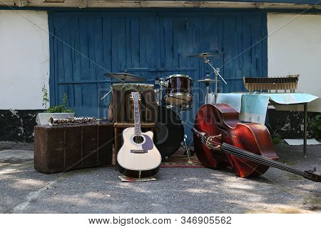 Selective Focus Microphone And Blur Musical Equipment Guitar , Lyric, Drum Piano Background.