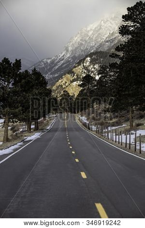 The Road Traveling Past Sheep Lakes As It Winds Through The Mountains In Rocky Mountain National Par