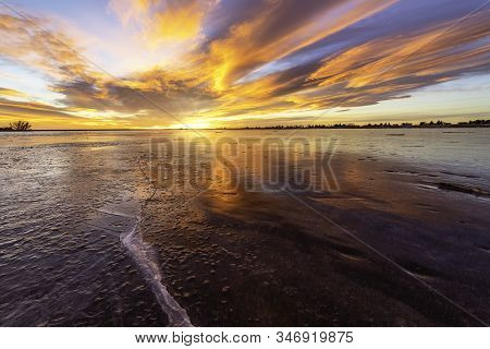 Colorful Sunrise On The Frozen Lake
