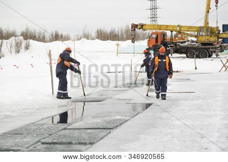 Installers In Life Jackets Rafting Ice Panels To The Lane With The Beograms