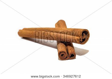 Flavored Cinnamon Sticks Isolated On A White Background. Two Sticks Of Dried Cinnamon Isolated On A 