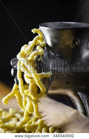 Making Italian Traditional Handmade And Homemade Passatelli Pasta - Typical Food From Modena And Bol