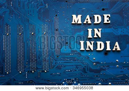 Inscription Made In India On A Blue Printed Circuit Board Background. Copyspace For Design. Label Ma
