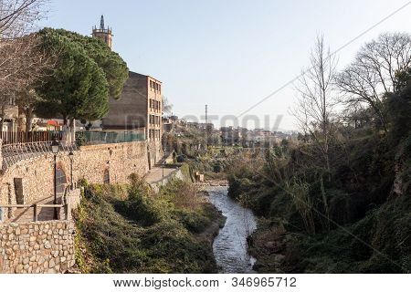 Caldes De Montbui Village In Catalonia, Spain And Its River Named Riera De Caldes