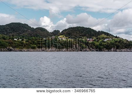 Houses And Buildings On The Side Of The Mountain Ridge With A Great View Of A Fjord North Of Stavang