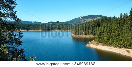 Dam And Reservoir On Lake Oasa, Romania. Waterworks Construction, Dam Oasa On Transalpina Highway In