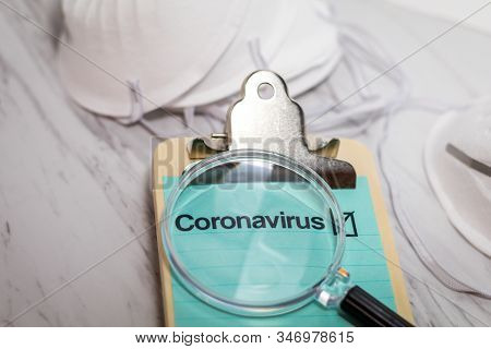 Coronavirus 2019-ncov Medical Still Life Concept On Clipboard With Mask And Needles