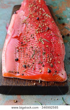 Gravlax, Scandinavian Beet Cured Spiced Salmon On The Board, Top View, Salted Red Fish