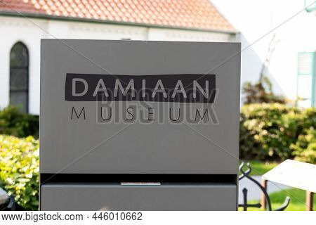 Tremelo, Flemish Brabant Region, Belgium - 09 23 2021: Sign At The Entrance  Of The Father Damien Mu
