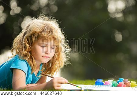 Children Artist Paints Creativity Vacation, Kids Crafts. Child Boy Drawing In Summer Park, Painting 