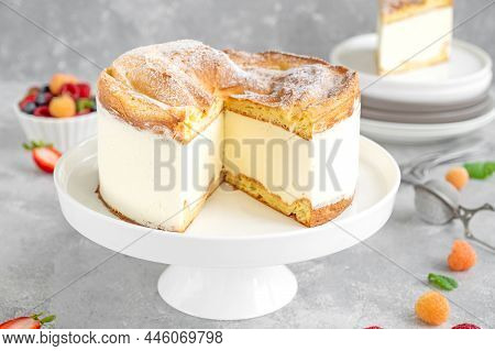 Traditional Polish Cake Karpatka On A Gray Concrete Background. Cake Of Choux Pastry Dough And Custa