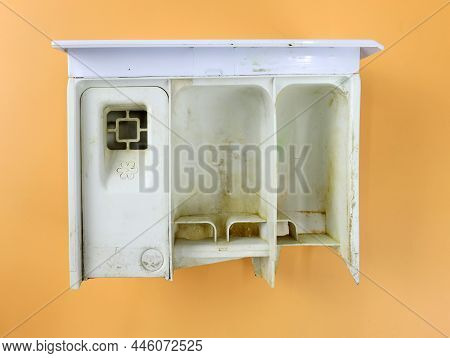 Dirty Plastic Compartment From The Washing Machine On A Beige Background. White Powder Container. De