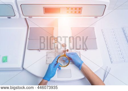 Laboratory Assistant Works At Paraffin Wax Dispenser Tissue Embedding Machine.