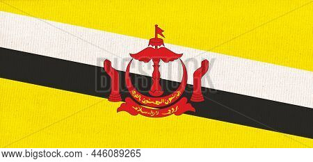 Flag Of Brunei. Nation Of Brunei Flag On Fabric Surface. Brunei National Flag On Textured Background