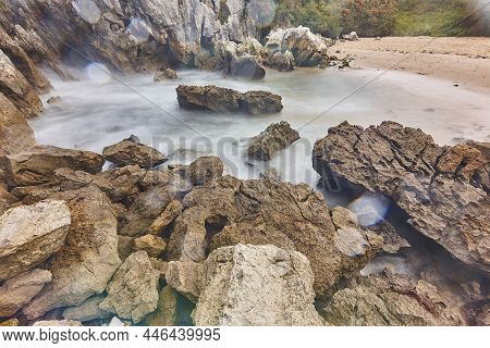 Picturesque Inlet Sand And Rocky Beach In Asturias, Gulpiyuri. Spain