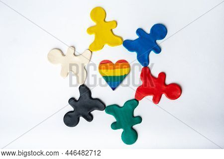 Rainbow Heart Shape In The Center And Multicolored Bright Plasticine People In A Circle Isolated On 