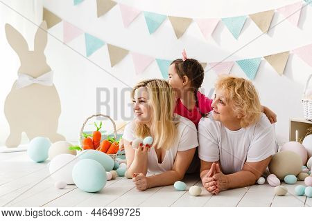 Happy Family With Easter Eggs. Happy Llittle Girl And Grandmother With Easter Eggs