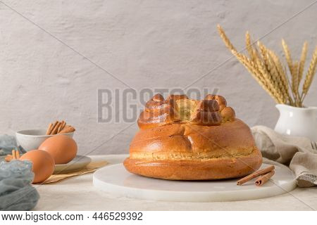 Fogaça On Kitchen Countertop With Eggs And Cinammon Sticks. Traditional Cake From Santa Maria Da Fei