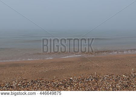 Calm On A Foggy Shell Beach Morning