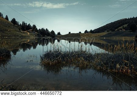 Lake Of The Confins And Mountain Landscape At Sunrise. La Clusaz, Haute-savoie, France