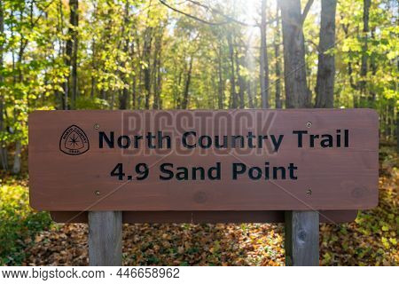 Michigan, Usa - October 19, 2021: Sign And Logo For The North Country Trail, 4.9 Miles To Sand Point