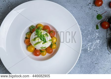 Salad With Buratta Cheese On White Plate Top View With Copy Space For Text