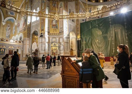 Belgrade, Serbia - January 6, 2022: Family, Kids, Father And Mother Praying For Orthodox Christmas (