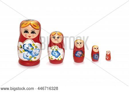 Red Dolls On A White Background. Russian National Souvenir. Matryoshka.