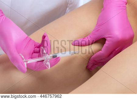 Aesthetic Cosmetologist Makes Lipolytic Injections To Burn Fat On The Thighs, Hips And Body Of A Wom