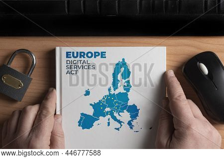 Digital Services Act Concept: Man Hold A Book With European Union Shape And The Text Europe Digital 