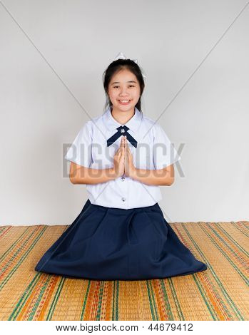 Betale reverens for Asian Thai gymnasieelev
