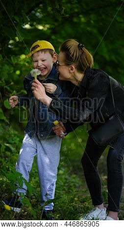 A Series Of Photos With A Child With Autism. Down Syndrome. Boy With Cerebral Palsy. Walks In Nature