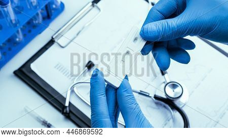 Coronavirus Test Antigen Covid Kit. Doctor Holding Rapid Covid Medical Test. Laboratory Hospital Lab