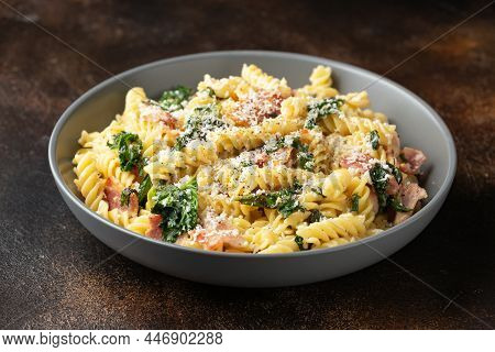 Fusilli Pasta With Bacon, Kale And Parmesan Cheese. Healthy Food