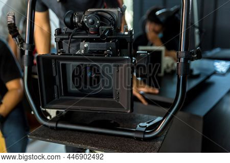 Movie Shooting Or Video Production And Film Crew Team With Camera Equipment. Video Camera Operator W