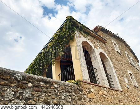 Stone Facade In Masia In The Empordà Of Girona. Stone Wall In Traditional House In Countryside. Arch