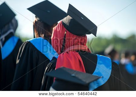 Behind view of muslim woman on a graduating ceremony