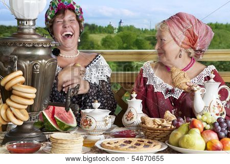 Women With Cup Of Tea Outdoors