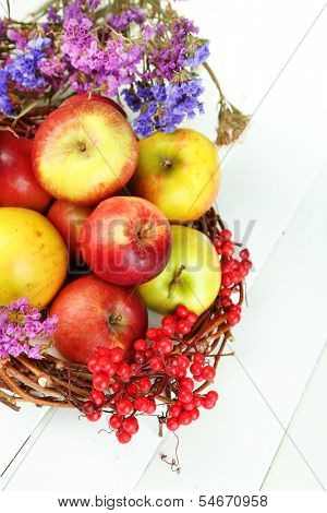 Juicy apples on white wooden table