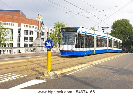 AMSTERDAM, THE NETHERLANDS - OCTOBER 7 2013:The Amsterdam tramway network  forms part of the public transport system.  Opened in 1875, the network has been operated since 1943 by GVB