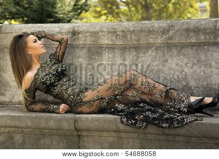 Attractive Brunette Beauty Posing In Elegant Dress.